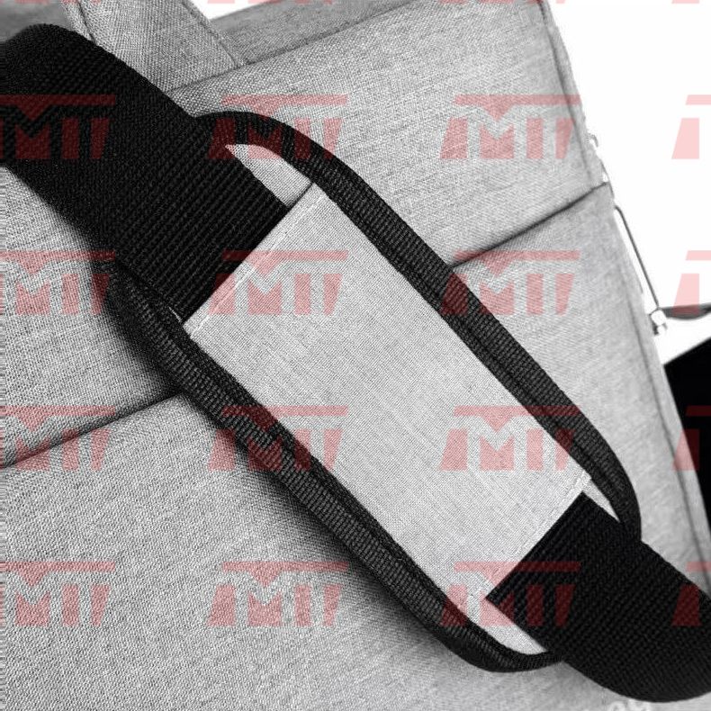Close-up detail of the padded shoulder strap cushion designed to relieve shoulder pressure.