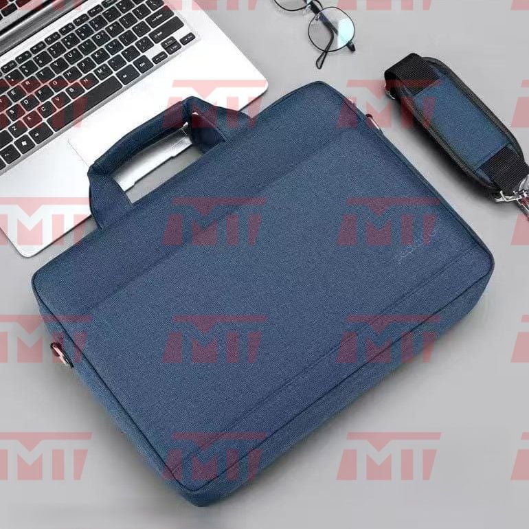 Flat lay view displaying the blue variant of the laptop bag alongside laptops and accessories.