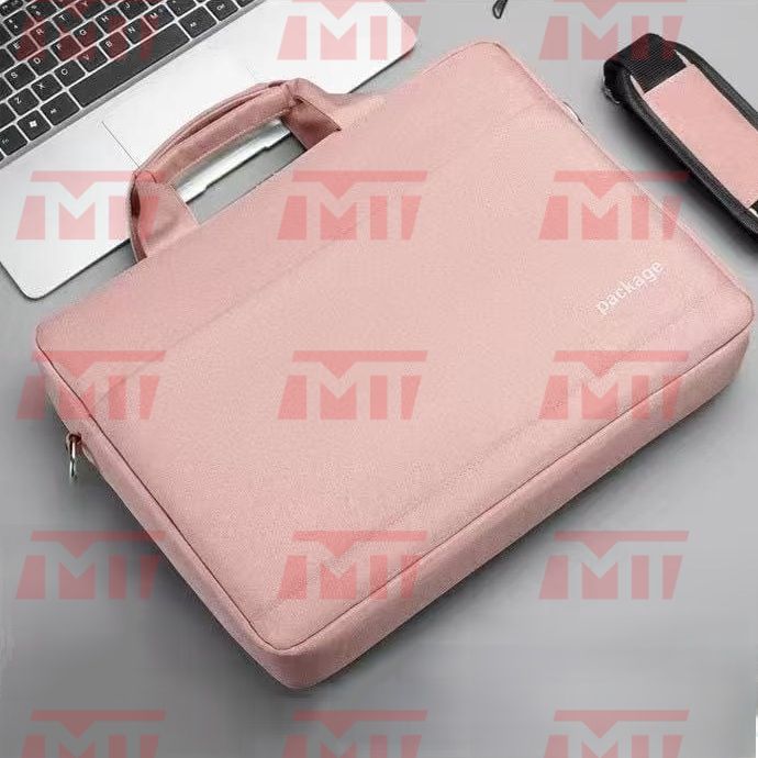 Flat lay view displaying the pink variant of the laptop bag alongside laptops and accessories.