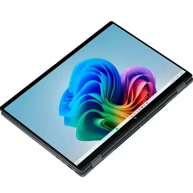 Top-down angled view of the HP OmniBook Ultra Flip 14 x360 convertible laptop folded completely flat into tablet mode, showcasing its high-resolution touchscreen displaying a colorful Windows 11 wallpaper.