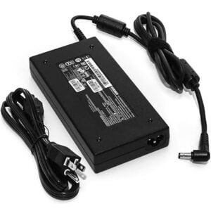 Full product kit overview showing the main adapter brick with safety labeling, attached DC cable with ferrite bead, and detachable AC power cord.