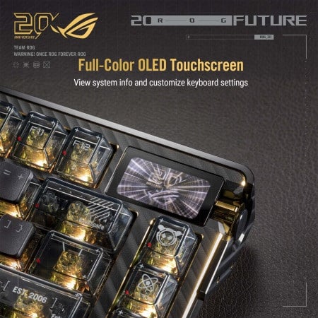 Close-up view of the top-right corner of the ROG Azoth Extreme Edition 20 keyboard, showing the full-color OLED touchscreen, translucent keycaps, and gold-accented frame.