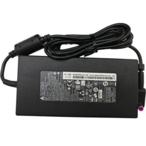 Top-down view of the 135W AC power adapter featuring the main specification label, an inline ferrite core filter on the DC cable, a neatly coiled output cord, and a right-angle barrel connector with a purple-tipped pin tip.
