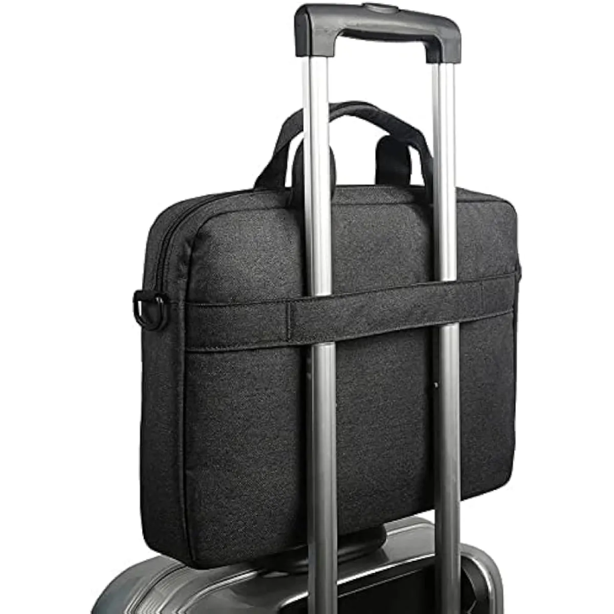 Rear view of the slim black Lenovo laptop bag featuring a integrated luggage strap slipped over the handle of a rolling suitcase.