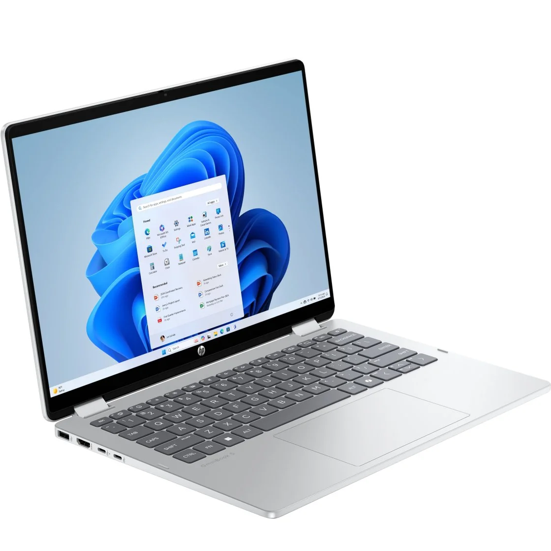 Front-right angled perspective of the HP OmniBook x360 14-ap0xxx laptop open, showcasing its full keyboard, centered trackpad, and Windows 11 interface.