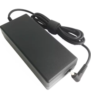 Angled perspective view of the matte black Delta 120W AC power adapter brick showcasing its plain top casing, attached DC output cable tied with a velcro strap, and right-angle 5.5x2.5mm barrel connector tip.