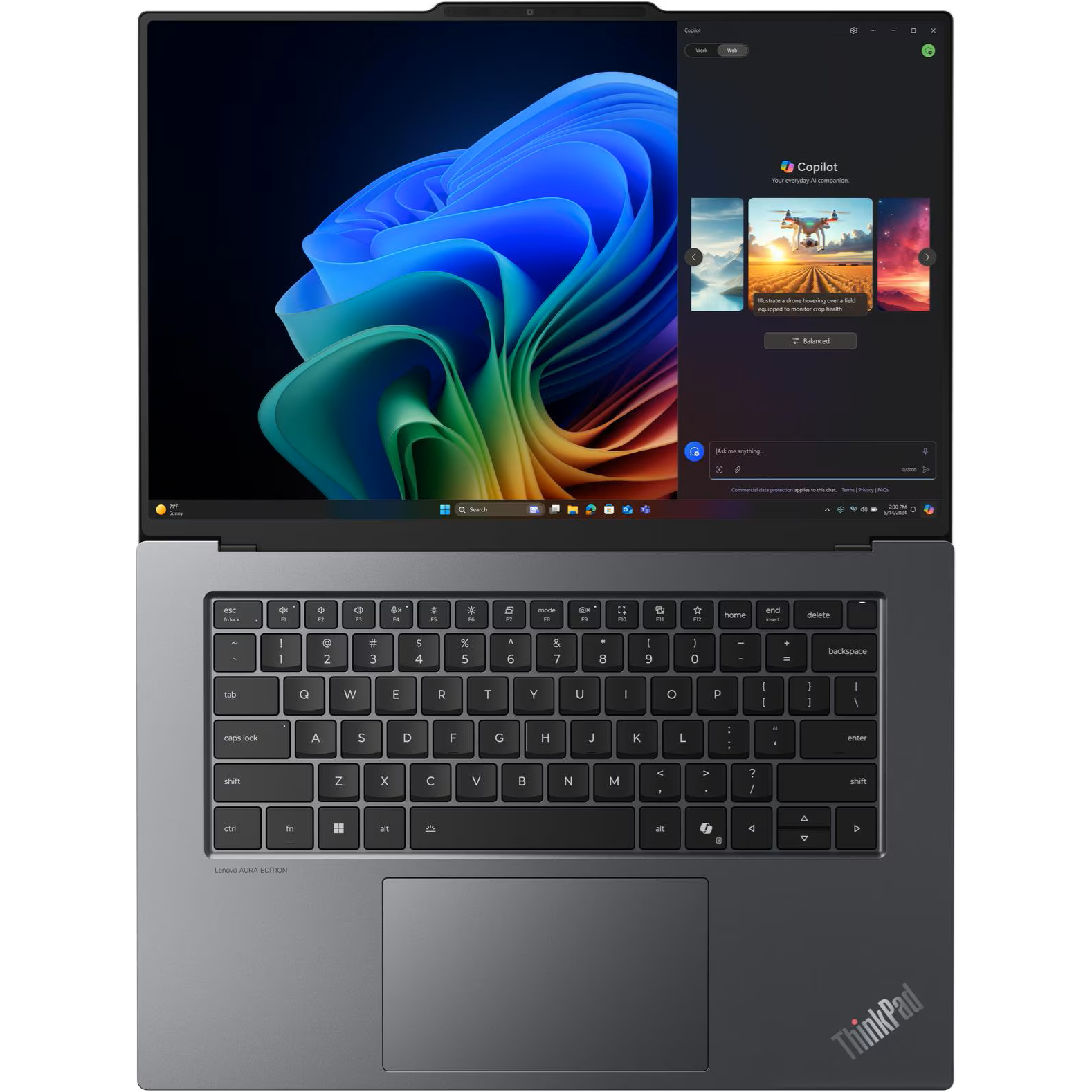 Overhead view of the open Lenovo ThinkPad X9-15 Gen 1 AURA Edition showing its keyboard deck, centered touchpad, ThinkPad branding, and 15.3-inch OLED display running Windows 11 with Microsoft Copilot open.