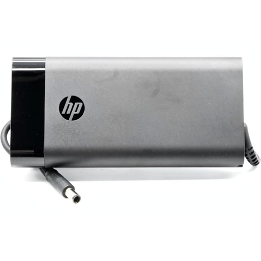 Top-down perspective of the HP 230W power adapter highlighting its sleek dark metallic chassis, embossed HP logo, and attached cable with a 7.4x5.0mm barrel plug.