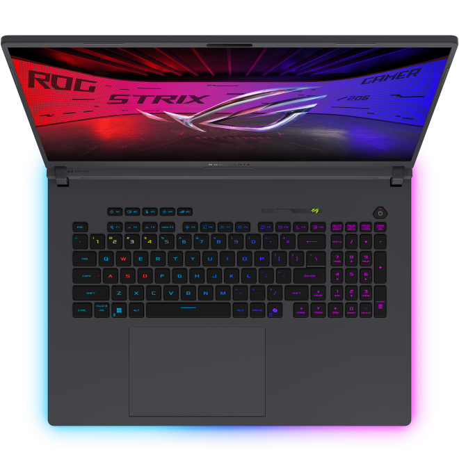 Top-down perspective of the open ASUS ROG Strix G18 displaying its full-sized per-key RGB backlit keyboard, dedicated media keys, and wide glass trackpad.