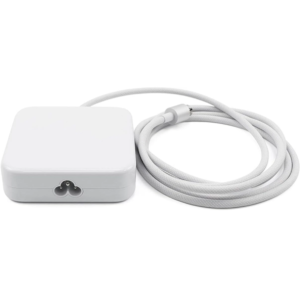 Perspective view of the glossy white Apple 143W iMac power adapter showing its cloverleaf AC power inlet socket alongside its coiled white braided cable equipped with a magnetic power connector.